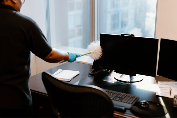 Impact Commercial Cleaning Services Janitor clean the desktop computer