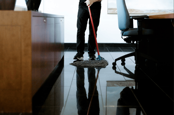 Impact Commercial Cleaning Services Janitor clean the floor