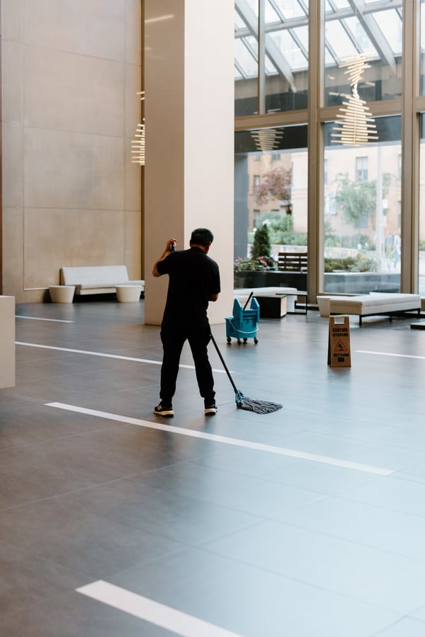 Impact Commercial Cleaning Services man cleaning the floor