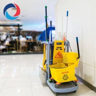 Cleaning equipment cart from a top commercial cleaning company in Burlington, ready for professional janitorial services in a polished, modern environment.