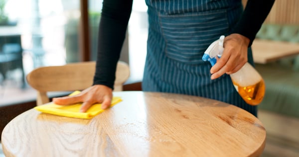 cafe table being cleaned