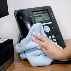 sanitizing-office-phone-after-hours-cleaning-toronto