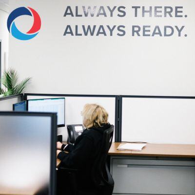 Employee workspace with the tagline "Always There. Always Ready," representing office restroom cleaning services in Burlington by Impact Commercial Cleaning Company.