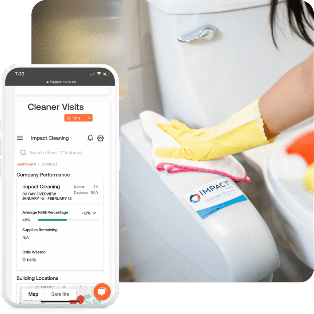 A person wearing yellow gloves cleans a toilet with a white cloth. In the foreground, a smartphone displays a cleaning management app showing visit details and company performance for Impact Cleaning.